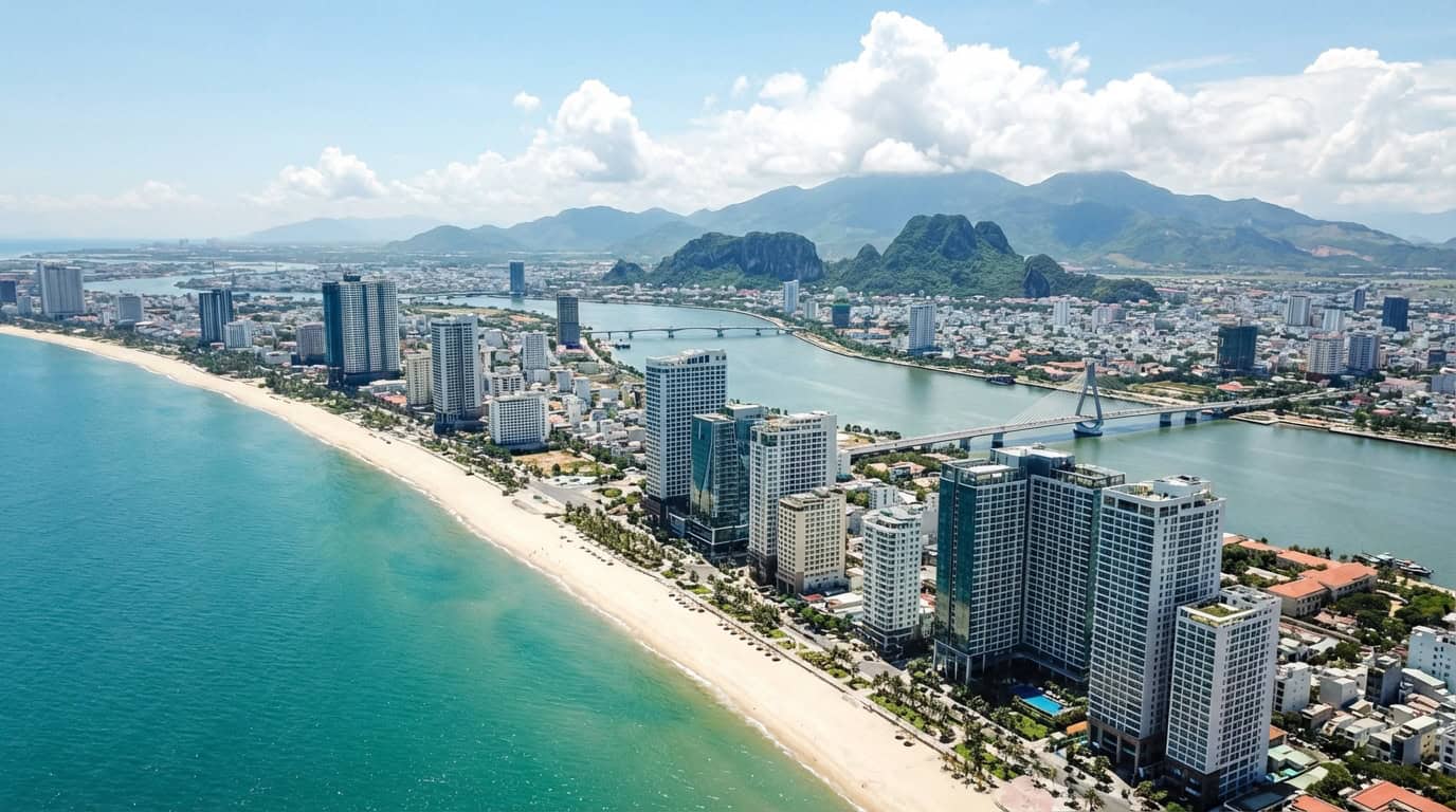 Aerial view of Da Nang beachfront cityscape with modern buildings and white sand beach